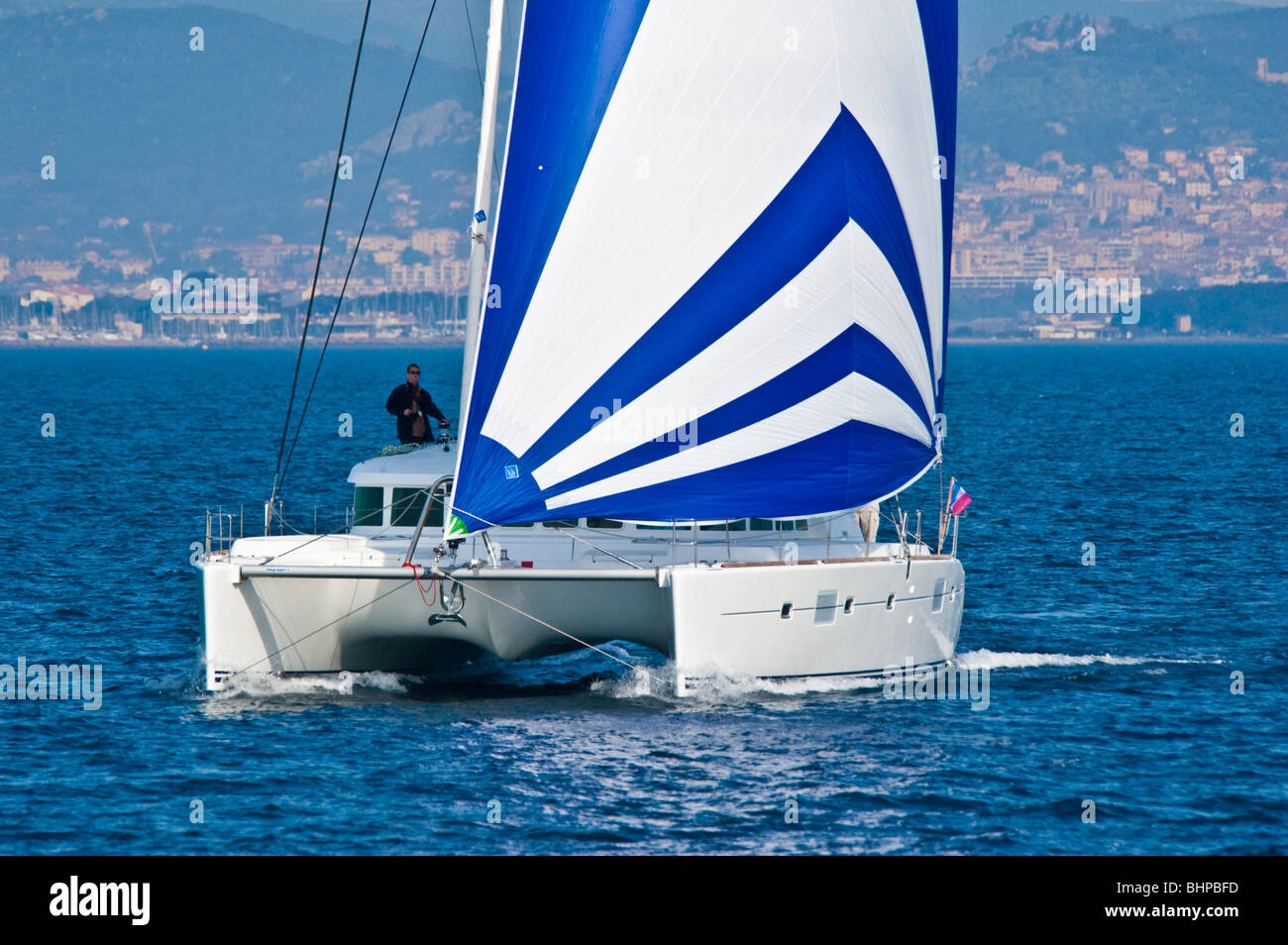 Sailors preparing spinnaker / gennaker / blister on a Lagoon 500