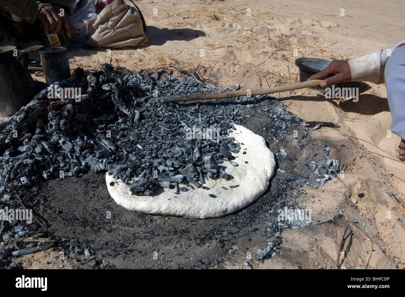 Bedouin men prepare the Libeh, a Bedouin version of simple unleavened