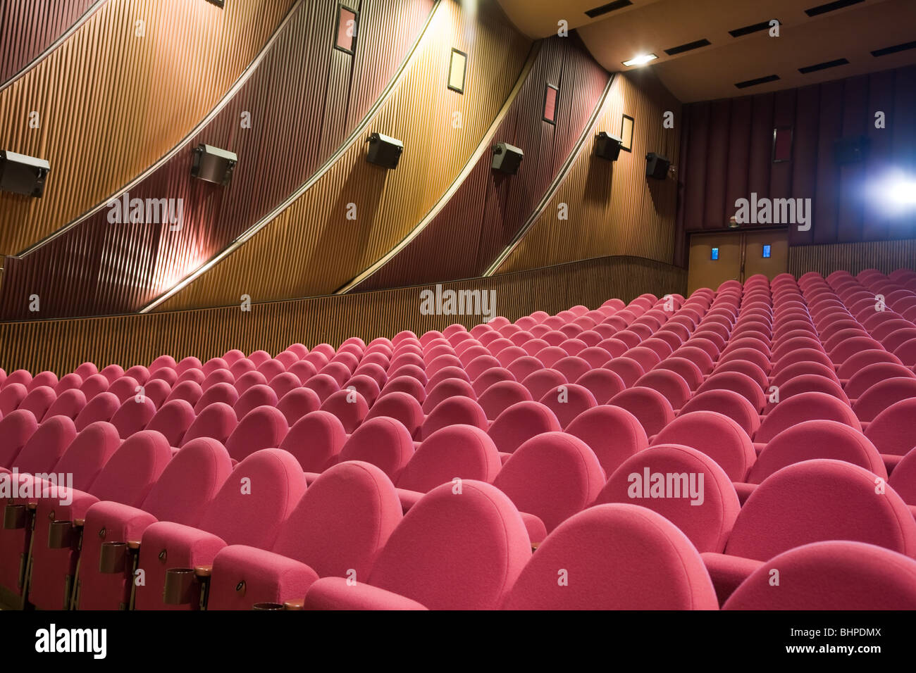 Empty cinema auditorium with light beam from projector. Stock Photo