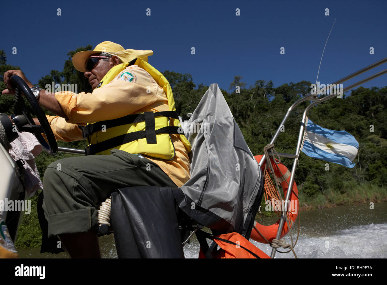 local tour guide driving speed boat iguazu national park, republic of argentina, south america Stock Photo