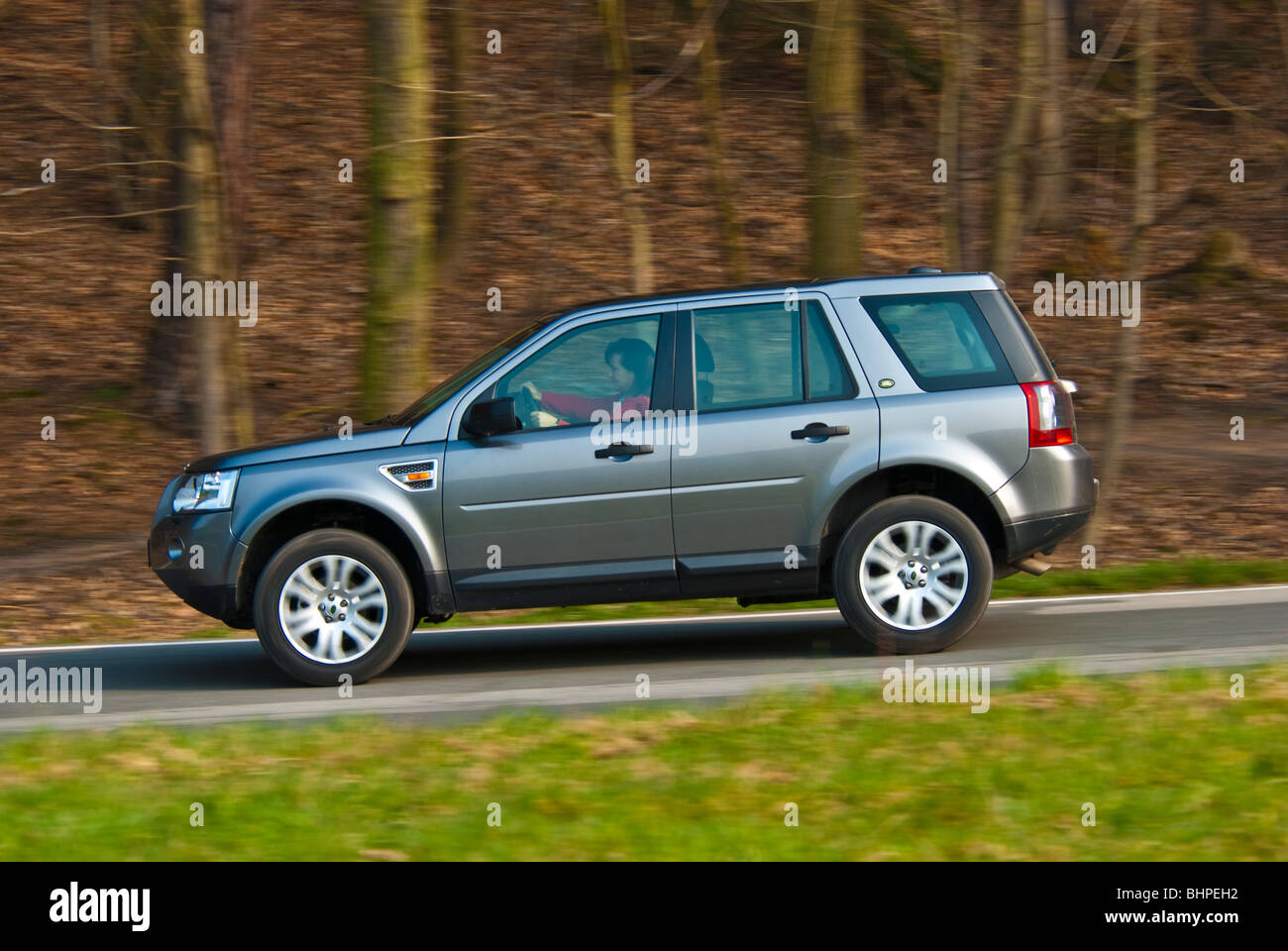 Land Rover Freelander, 2007 model, driving with high speed on a country road, Germany Stock Photo