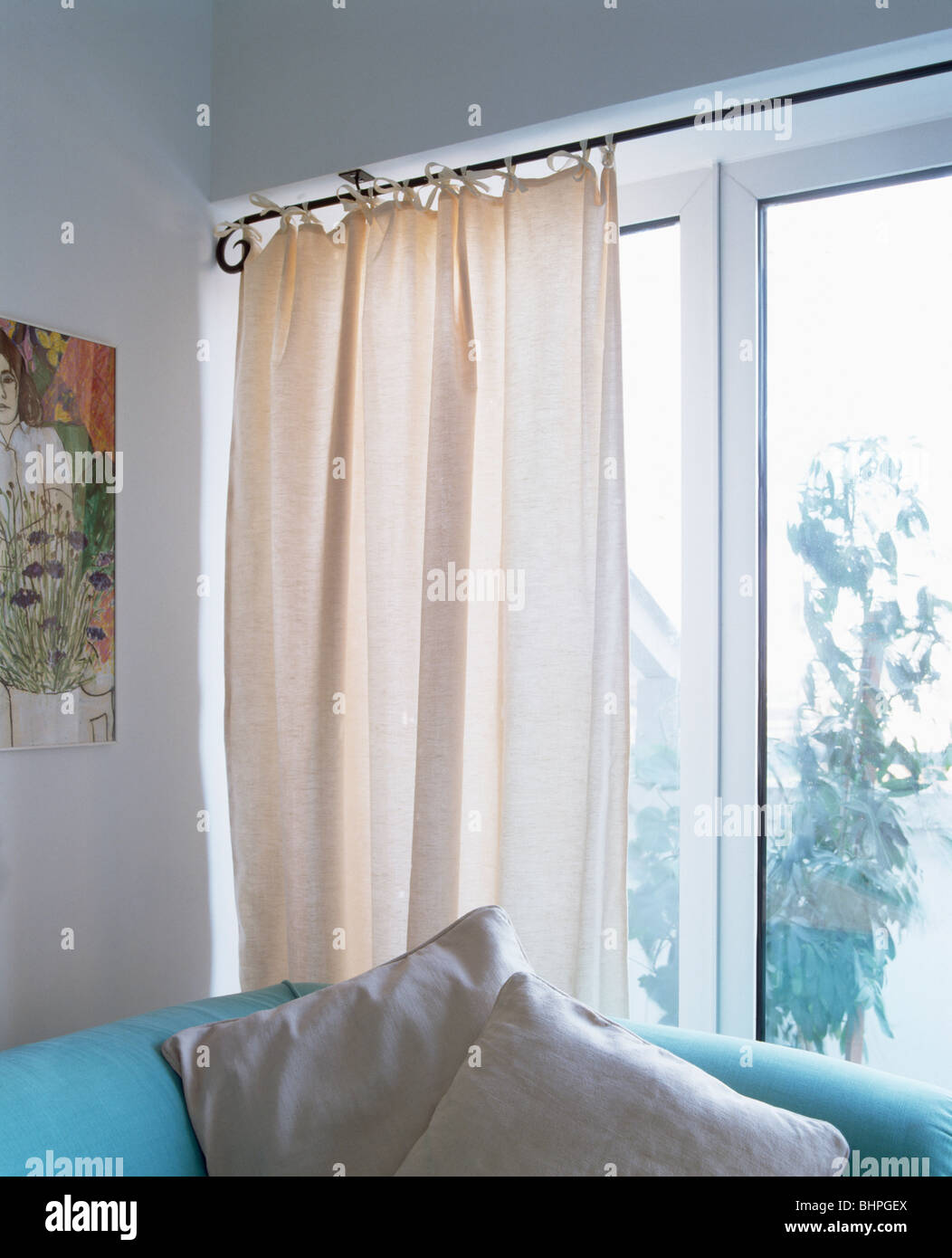 White Curtains On Metal Rail On Patio Doors In Modern Living Room