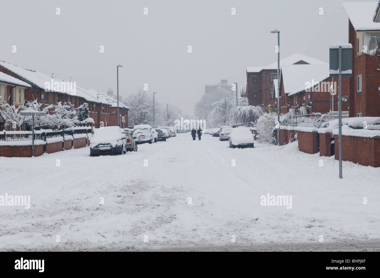 Cars and street covered with snow in Manchester UK Stock Photo