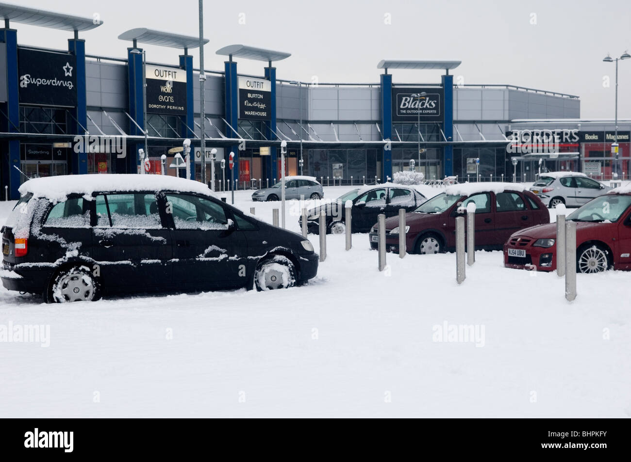Cars parked in parking lot in Manchester Fort shopping centre UK Stock