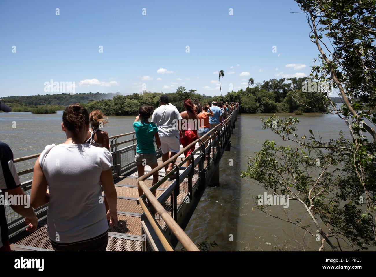 tourists on the devils throat circuit trail walkway in iguazu national park, republic of argentina, south america Stock Photo