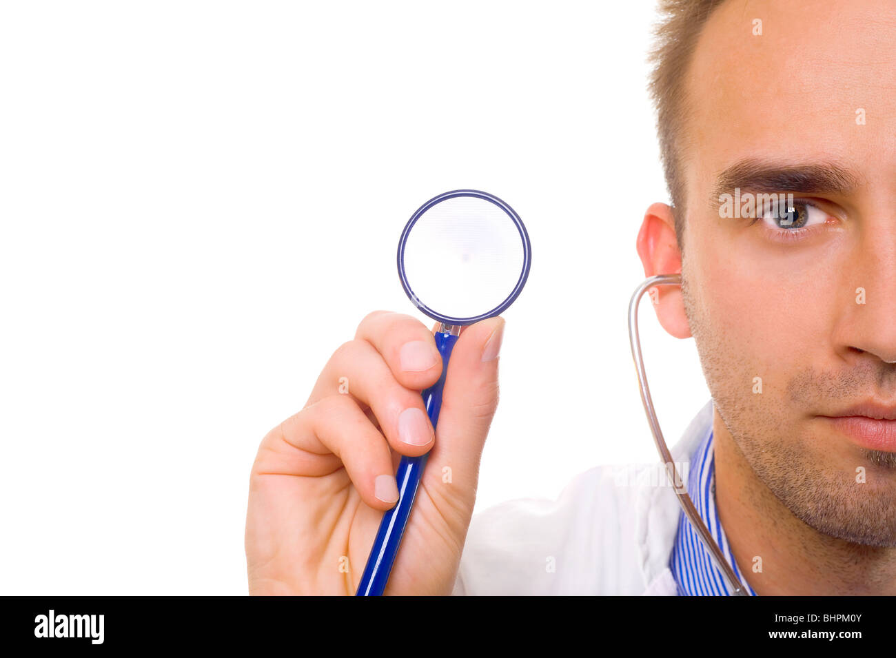Caucasian doctor holding stethoscope in hand, close up Stock Photo