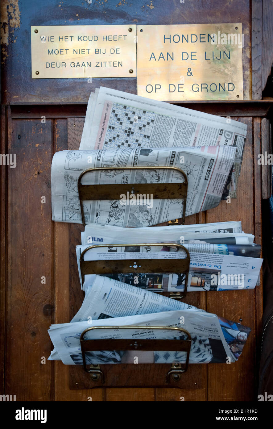 Amsterdam; Detail of newspaper rack inside old 17th Century Cafe Het