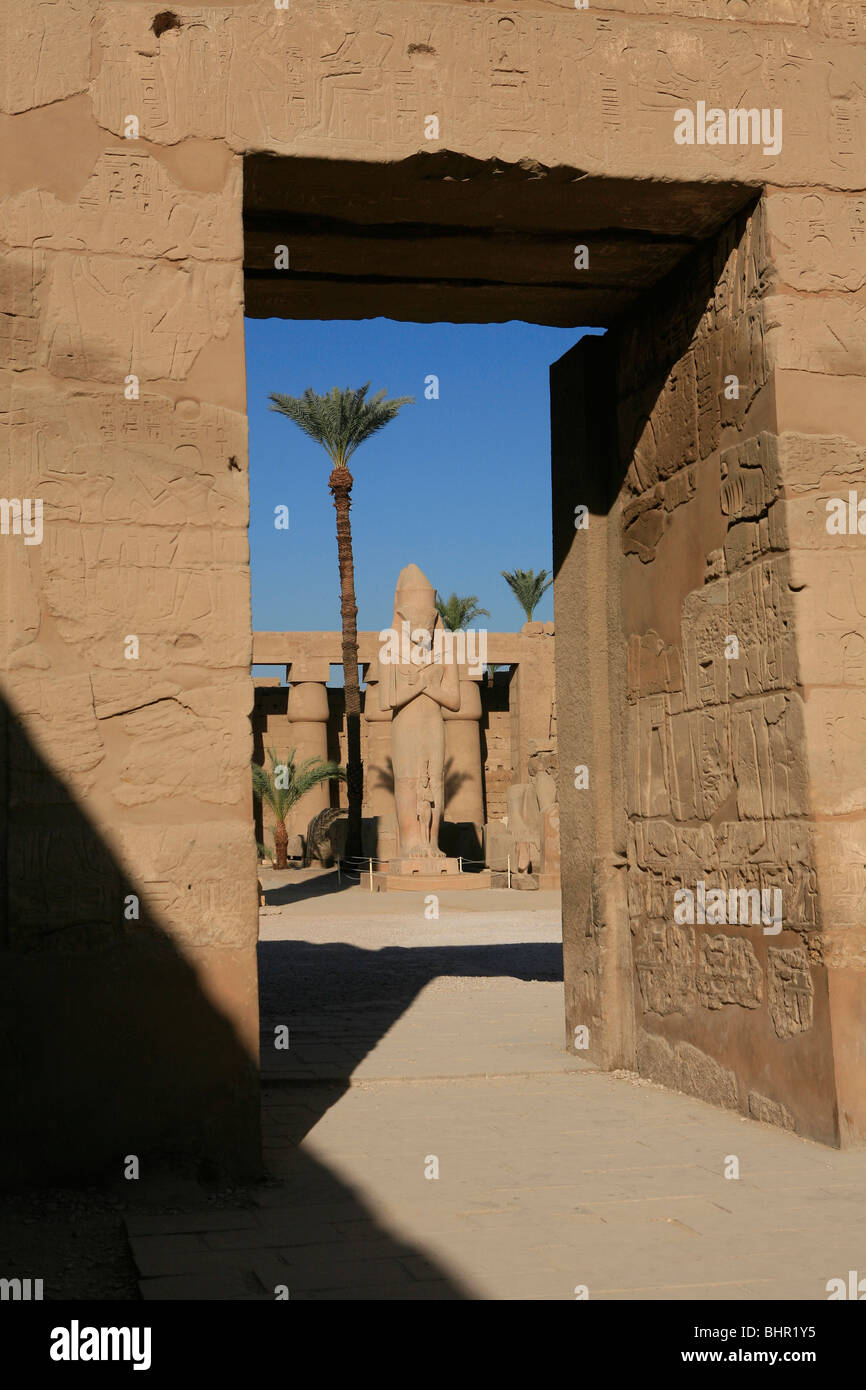 View from the Temple of Ramesses III at the statue of Ramesses II at the First Courtyard of Karnak Temple in Luxor, Egypt Stock Photo
