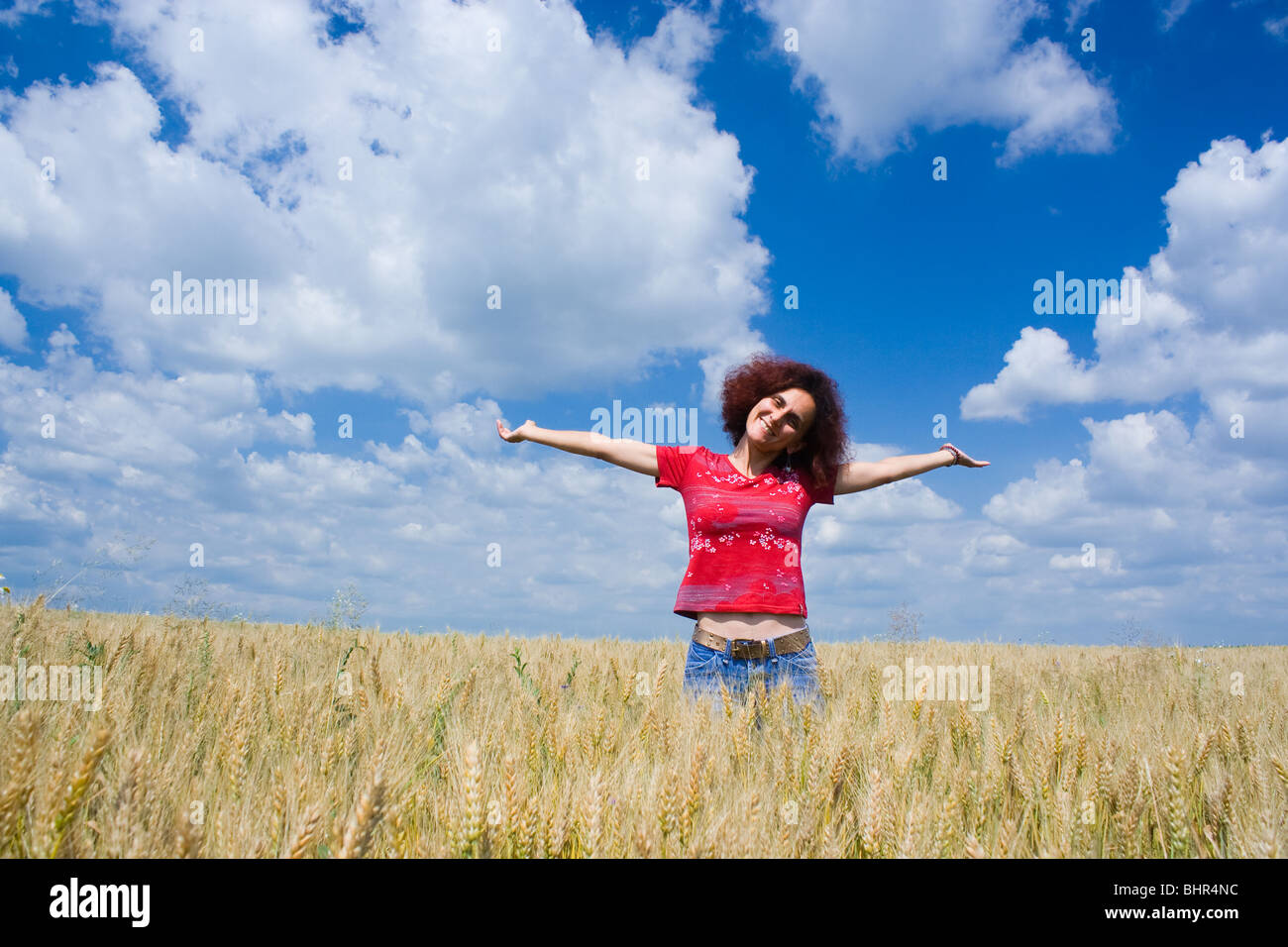 Portrait of an attractive woman in a wheat field Stock Photo - Alamy