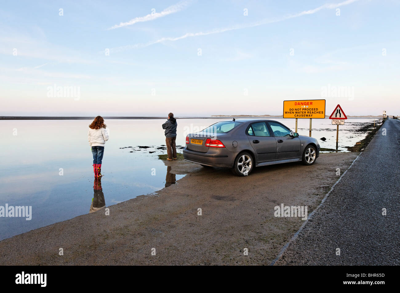 Motorists halted by rising tide on Lindisfarne Causeway to Holy Island on the Northumberland coast. Stock Photo