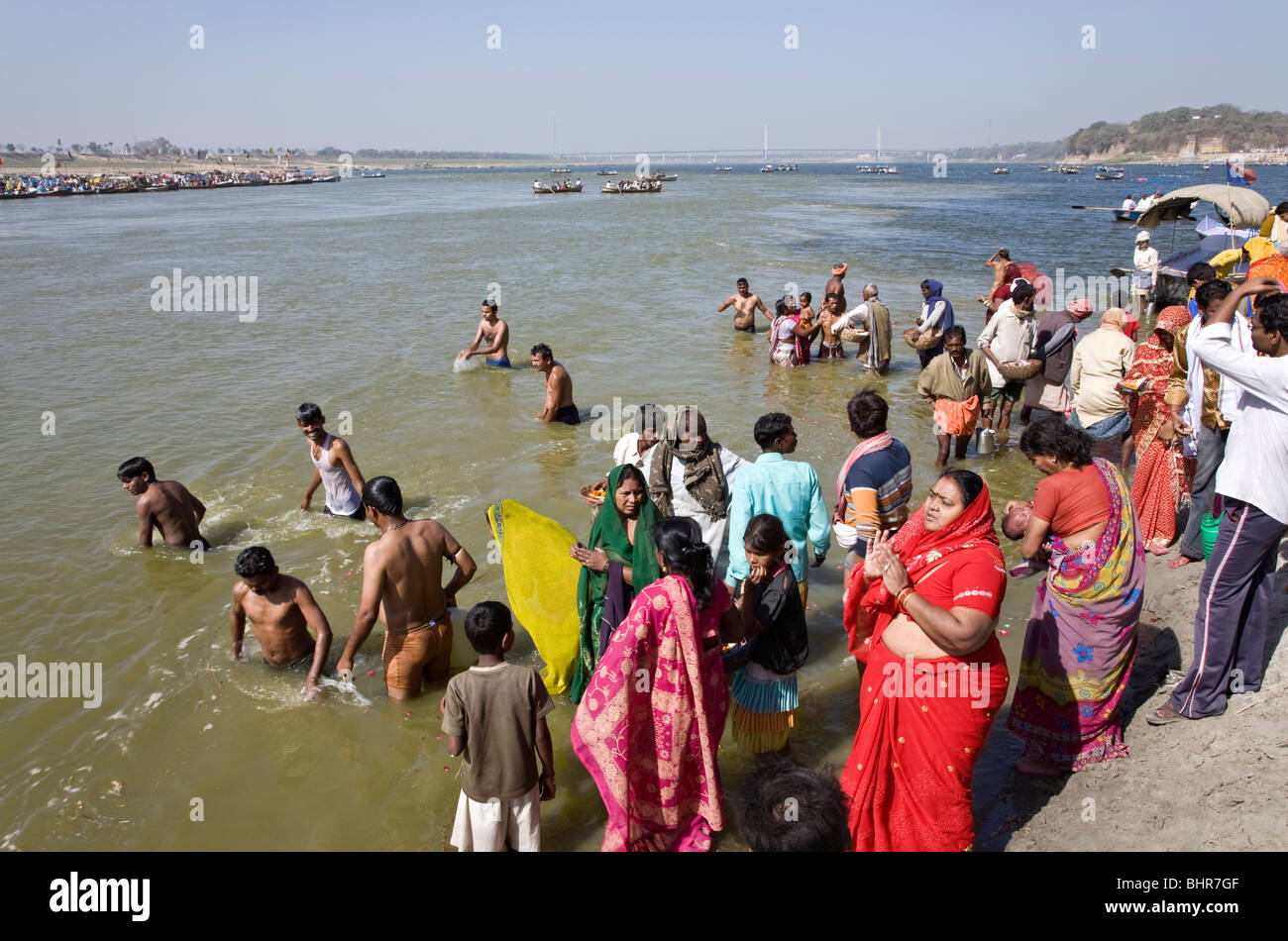 Pilgrims bathing in the confluence of the Ganges and Yamuna rivers (Sangam). Allahabad. India Stock Photo