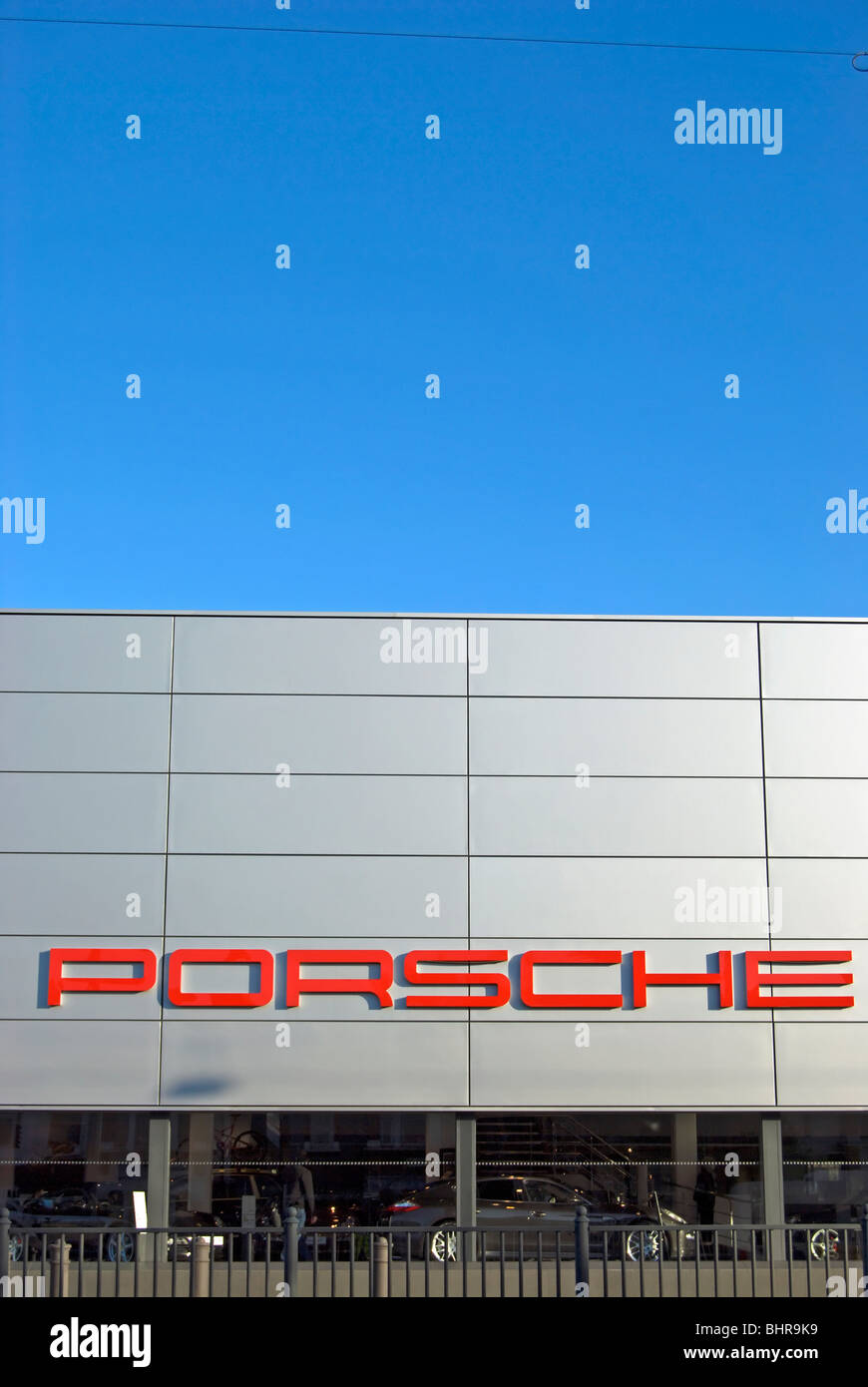 porsche logo at the company's showroom in chiswick, west london, england Stock Photo