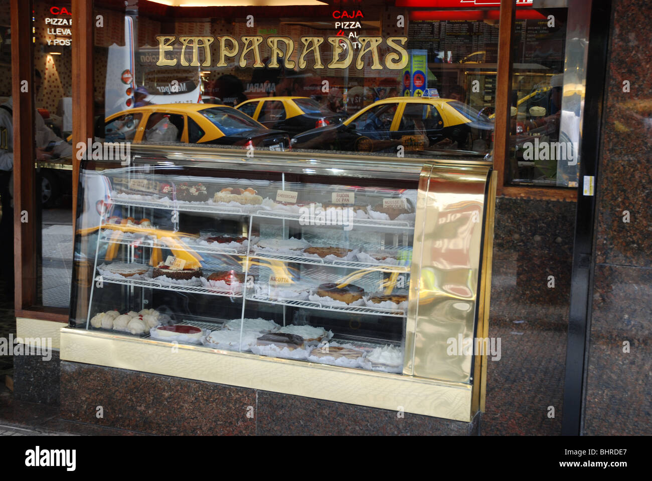 Taxis reflected in a bakery window in Buenos Aires Stock Photo