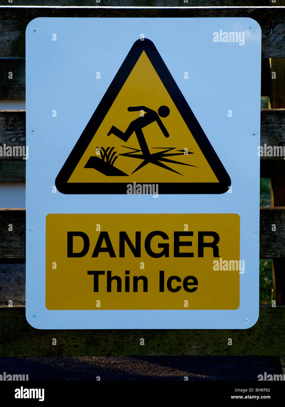 Danger thin ice sign next to canal, Bude, Cornwall, UK Stock Photo