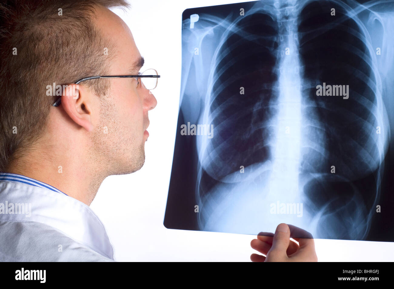 male doctor holding x-ray image on white background Stock Photo