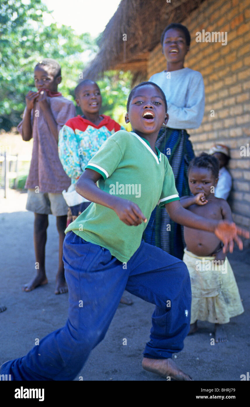 children dancing at a village near Kande, Lake Malawi, Malawi, Africa Stock Photo