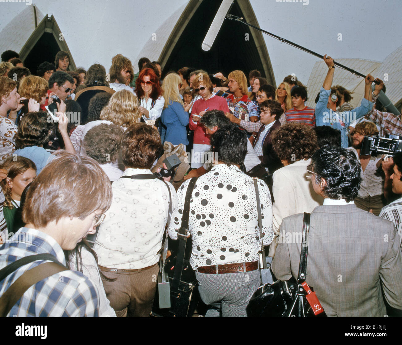 ABBA - Swedish pop group arrive in Sydney, Australia, in March 1979 and are mobbed outside the Sydney Opera House Stock Photo