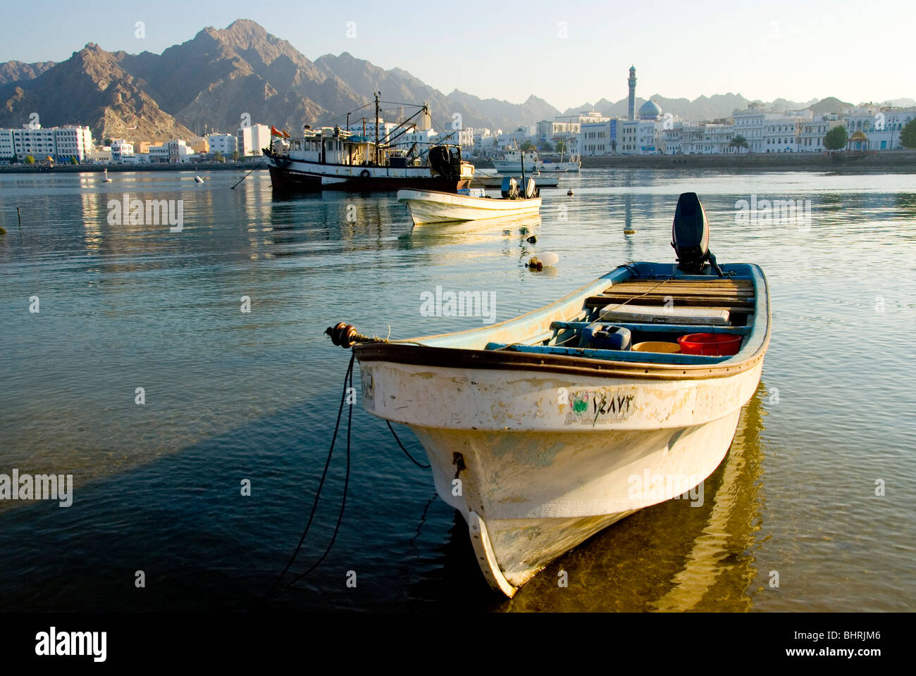 A small fishing boat in the harbour in Muscat, Oman Stock Photo