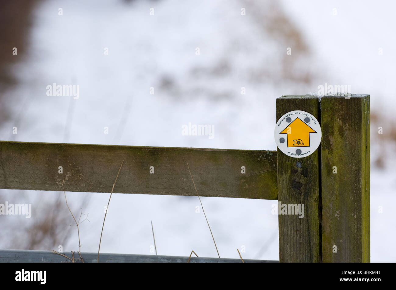 Post arrows showing direction of public footpaths in the winter after a ...