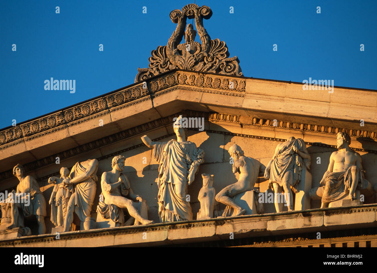 Detail of the pediment of the Glyptothek, Munich, Germany, bathed in golden evening light. Stock Photo