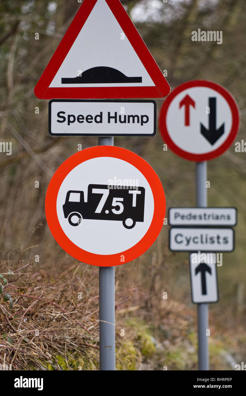 Road signs warning pedestrians, cyclists and motorists of hazards ahead Stock Photo