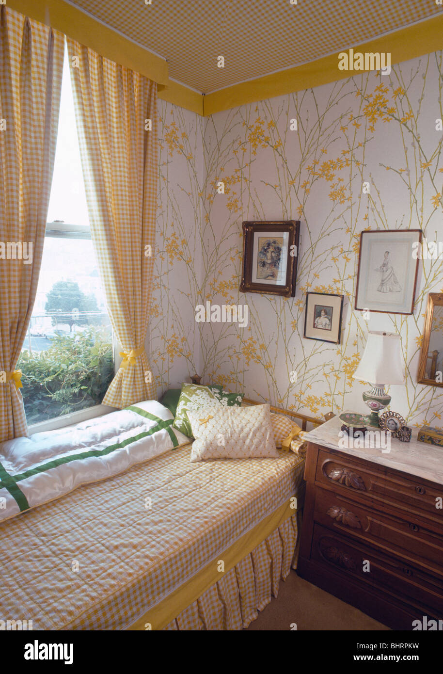 Yellow Checked Curtains On Window Above Bed With Cushions And