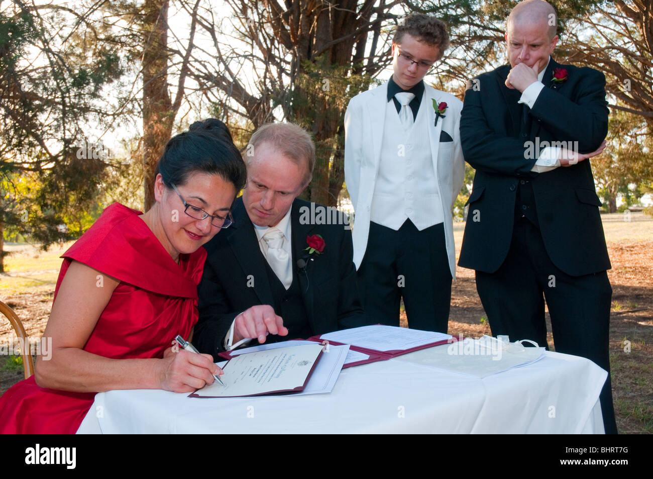 A mature couple sign the register at their civil wedding ceremony in Australia Stock Photo