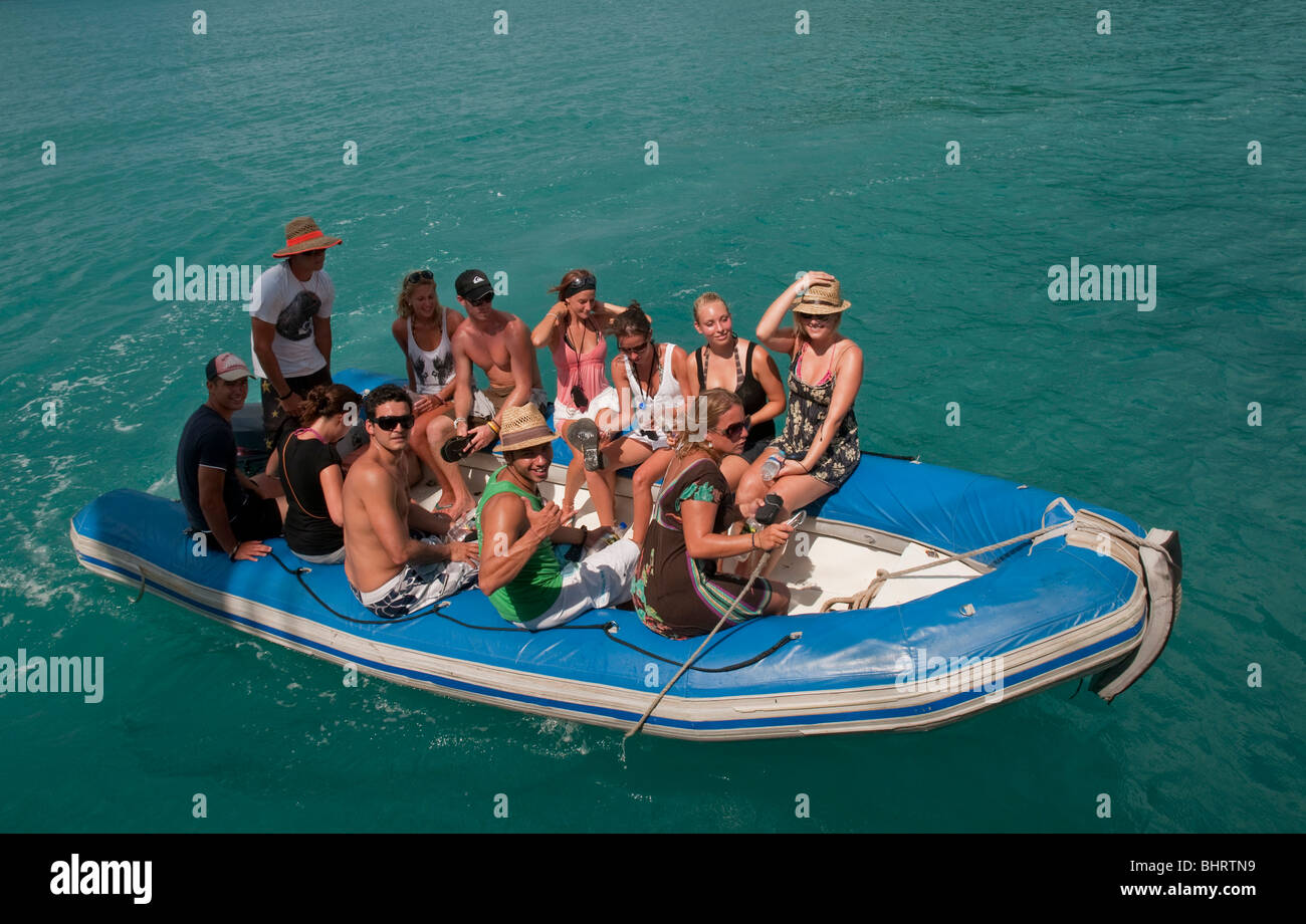 Tourists in dinghy in the Whitsunday Islands off the Queensland coast Stock Photo