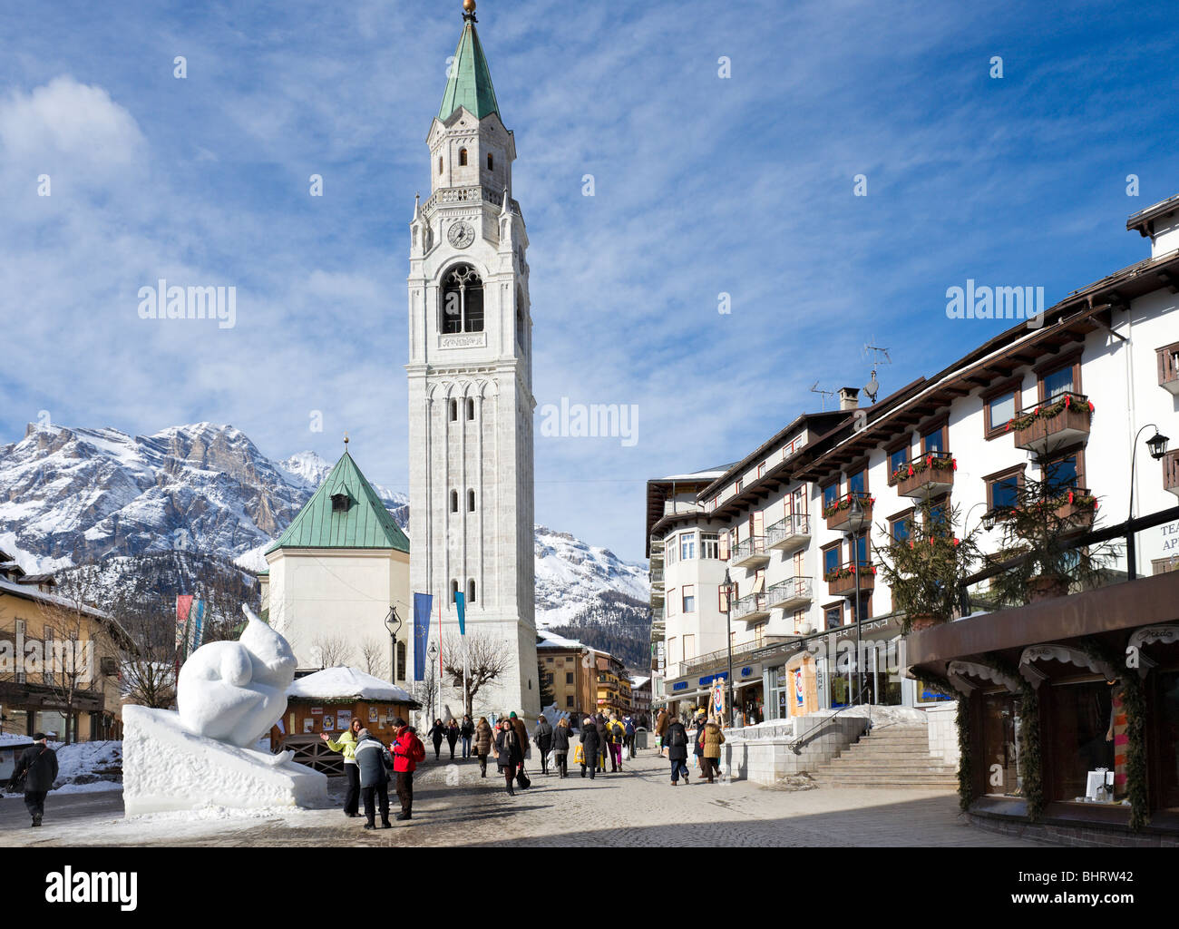 Snow sculpture in front of the church on Corso Italia, Cortina d'Ampezzo, Dolomites, Italy Stock Photo