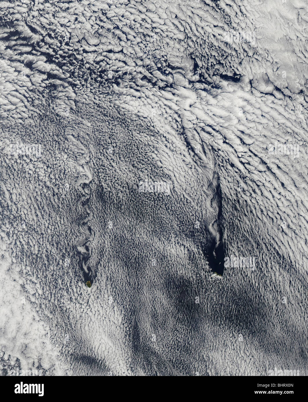 Clouds over the Juan Fernandez Islands form into vortices. Stock Photo