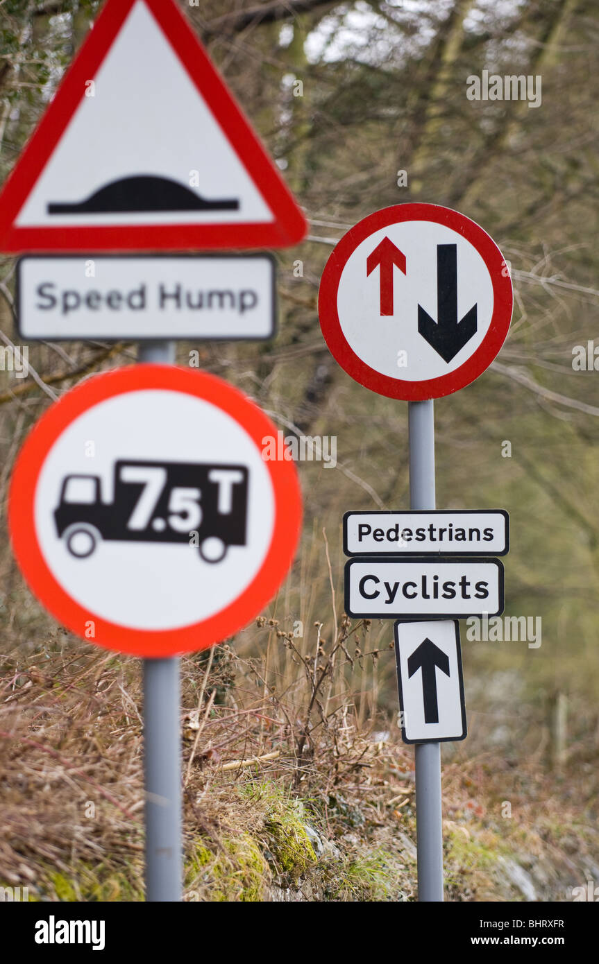 Road signs warning pedestrians, cyclists and motorists of hazards ahead Stock Photo