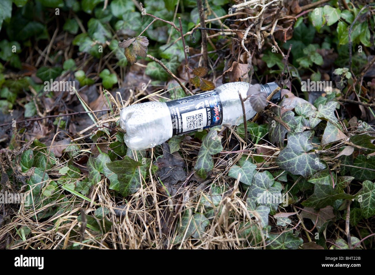 Plastic bottle rubbish thrown away in verge Stock Photo Alamy