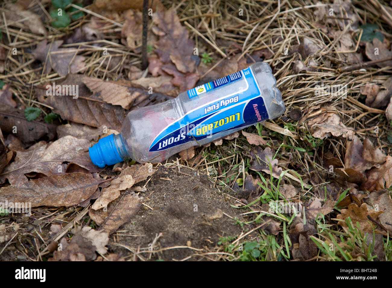Plastic bottle rubbish thrown away in verge Stock Photo