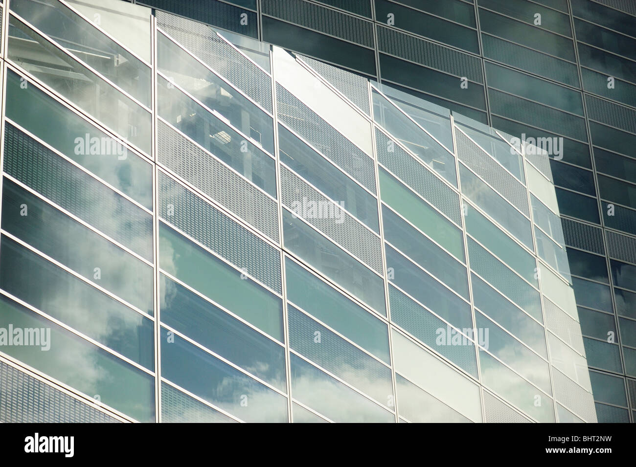 Reflections of clouds in office windows Stock Photo