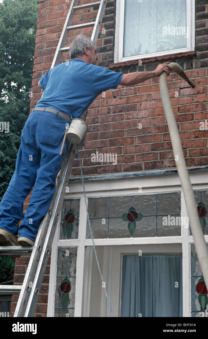 UK CAVITY WALL INSULATION BEING FITTED IN A HOUSE IN LONDON Photo