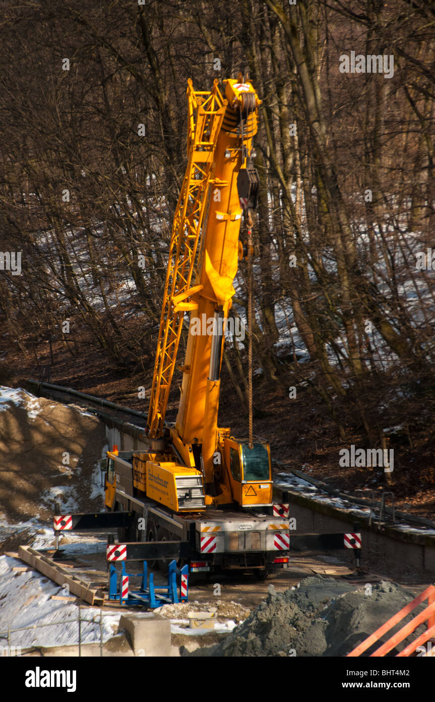 Industrial machinery on construction site on the Isar river in Munich, Germany Stock Photo