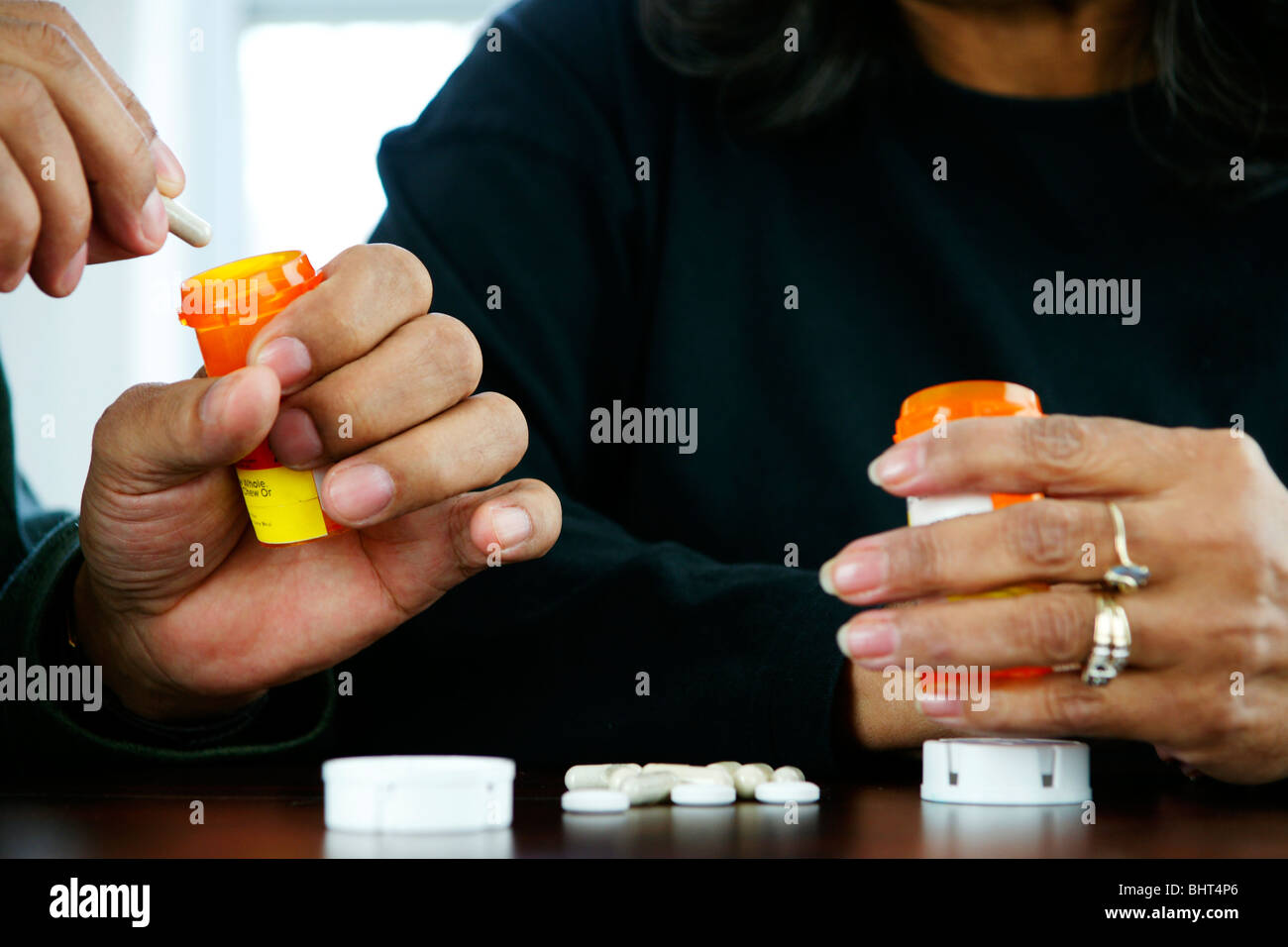 Seniors taking pills Stock Photo