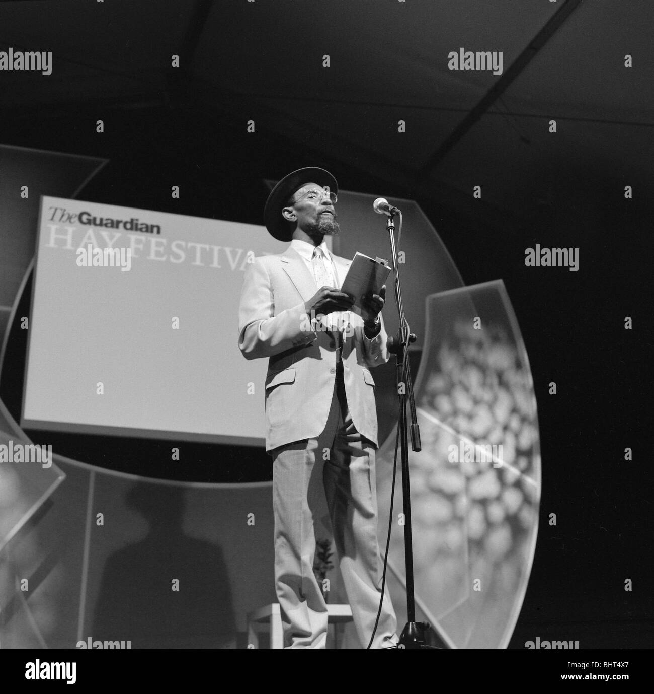 British Jamaican poet Linton Kwesi Johnson reading poetry on stage at the Guardian Hay Festival UK    KATHY DEWITT Stock Photo