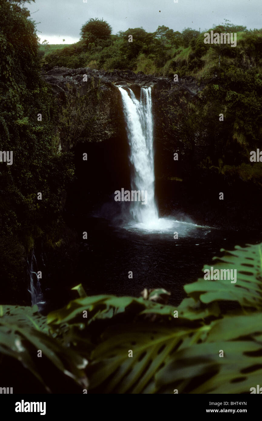 Rainbow Falls is a waterfall located in Hilo, travel photo Hawaii. color. 1976 Wailuku River color vertical water Stock Photo