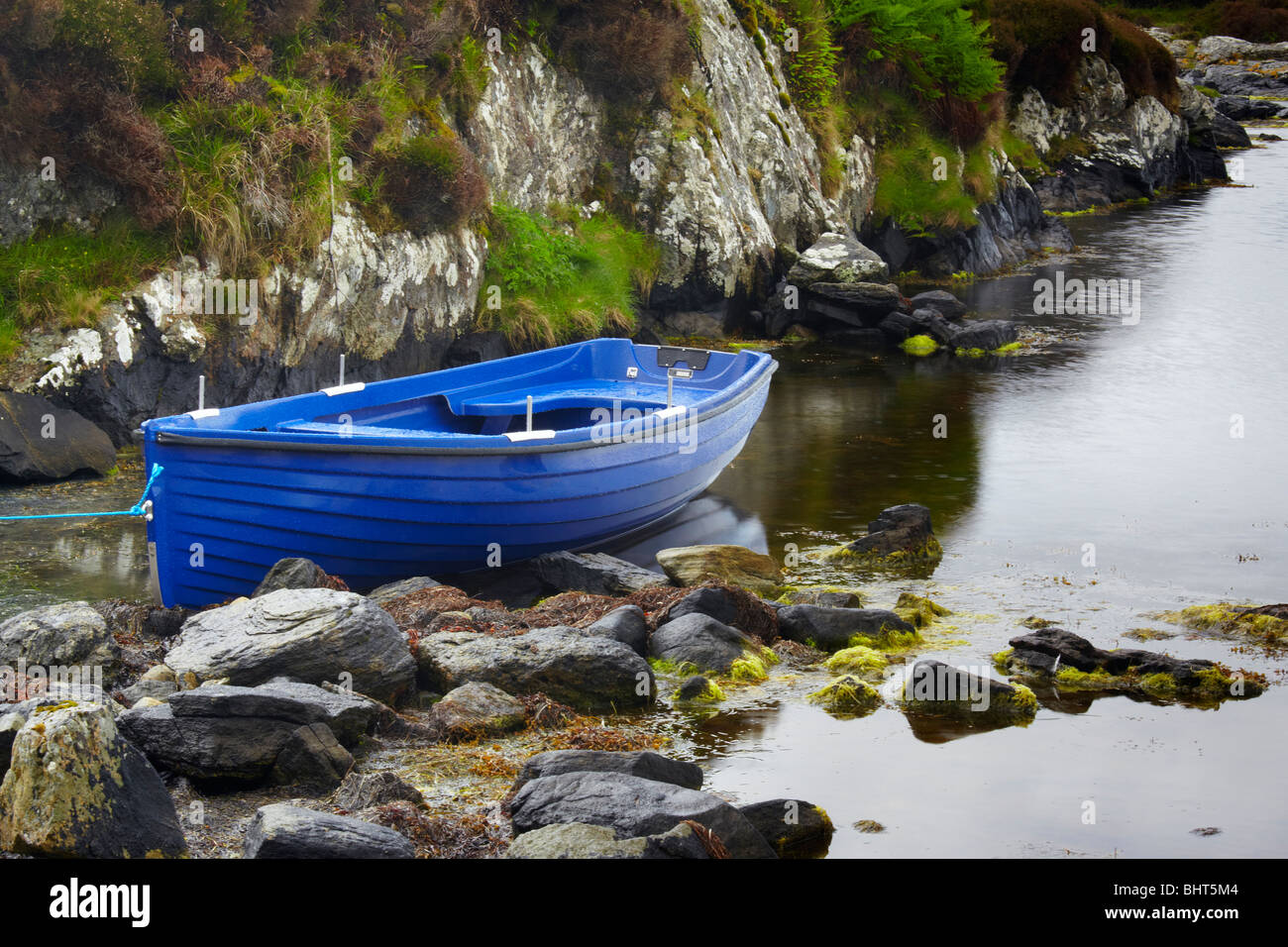 Blue boat, Lochportain, North Uist, Scotland Stock Photo