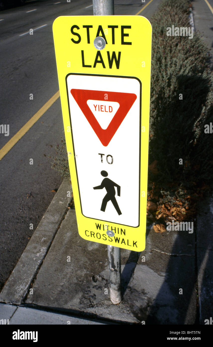 sign "State law, yield to pedestrians within crosswalk Stock Photo Alamy