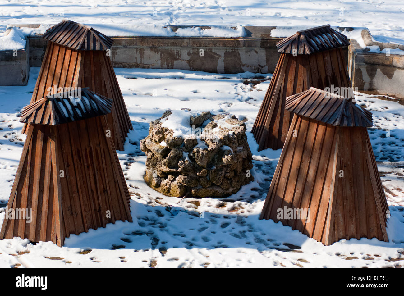 Fountain statues inside their winter coverings in Munich, Germany Stock Photo