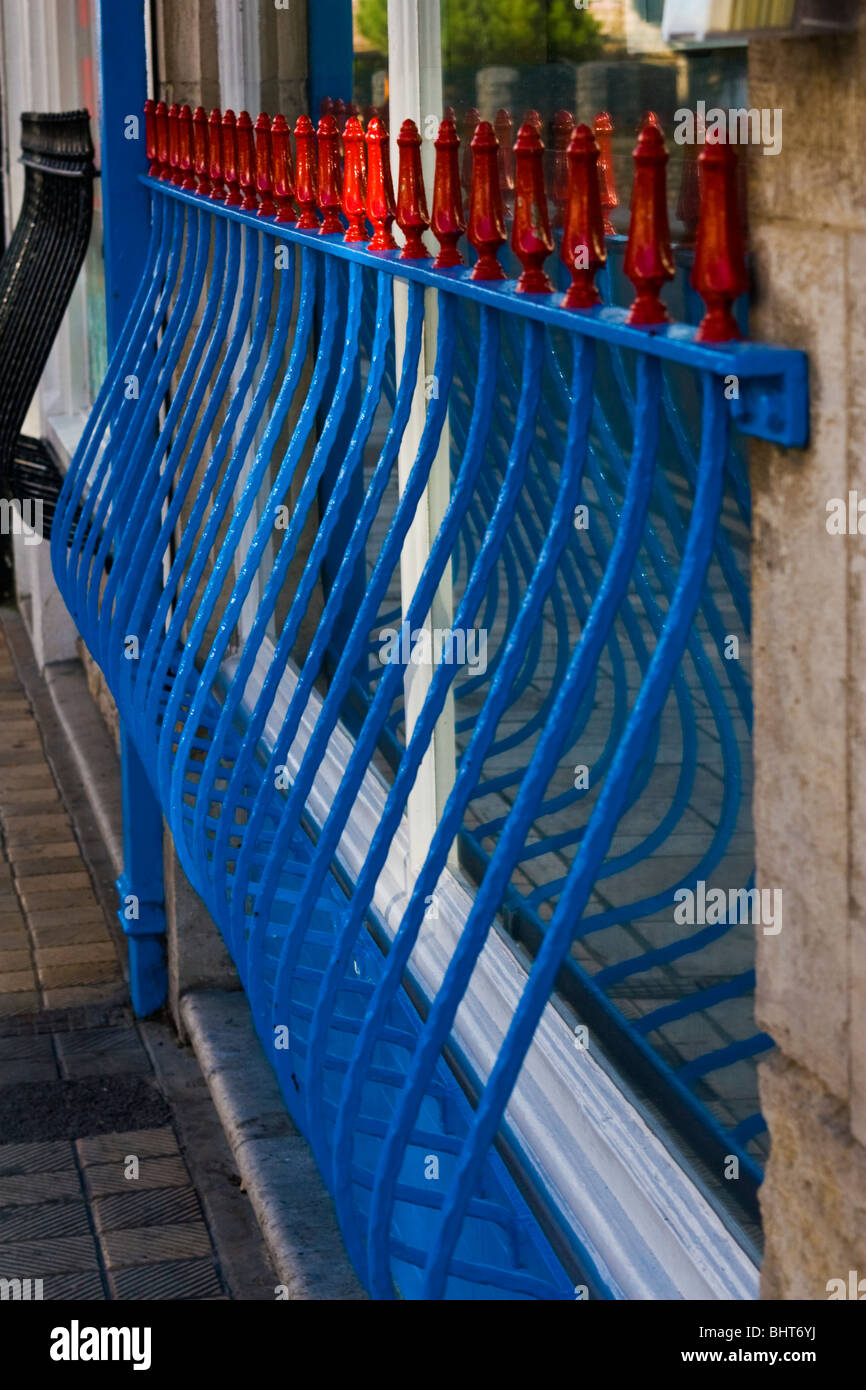 Blue decorative railings outside a shop in Swanage, Dorset, England. Stock Photo