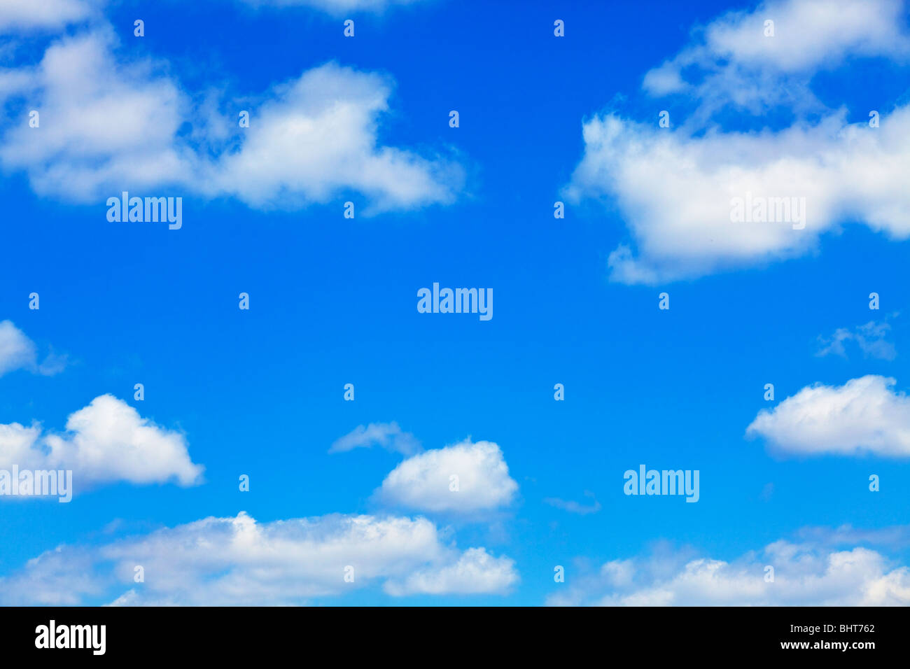 blue sky with white fluffy clouds background Stock Photo - Alamy