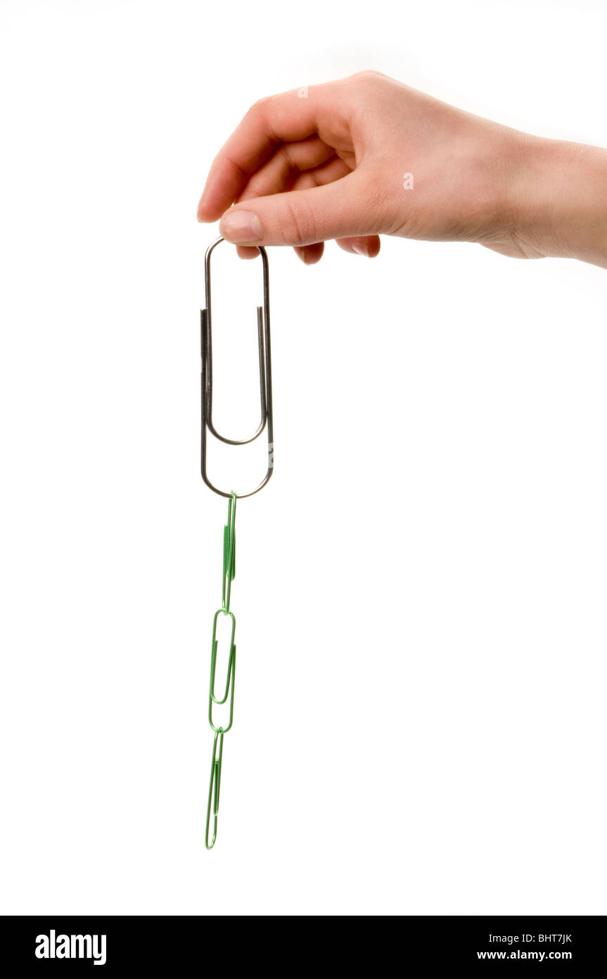 hand on white holding paper clips Stock Photo - Alamy
