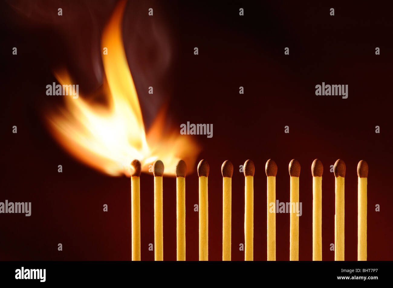 A line of matches igniting Stock Photo