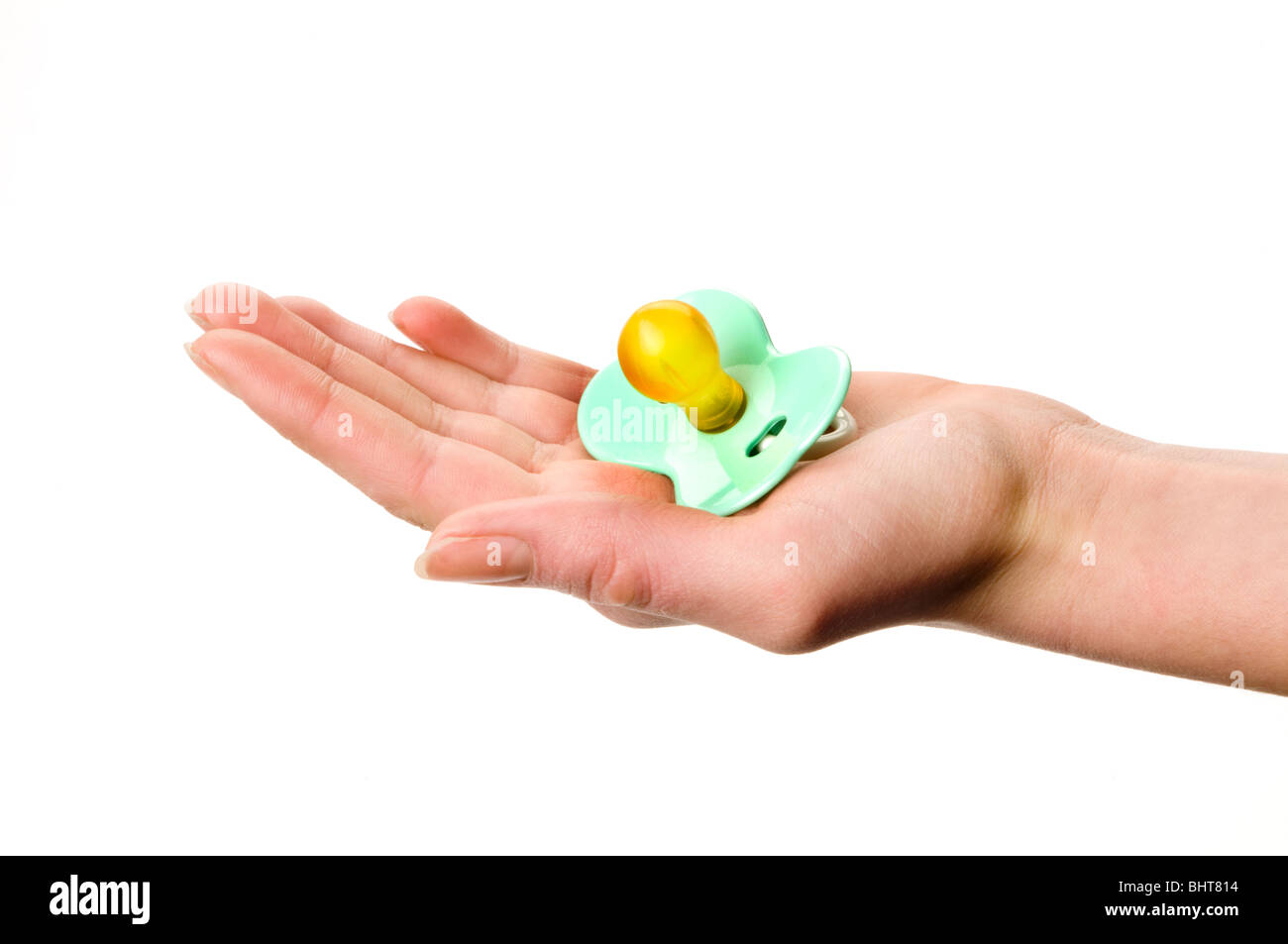 hand holding baby pacifier Stock Photo Alamy