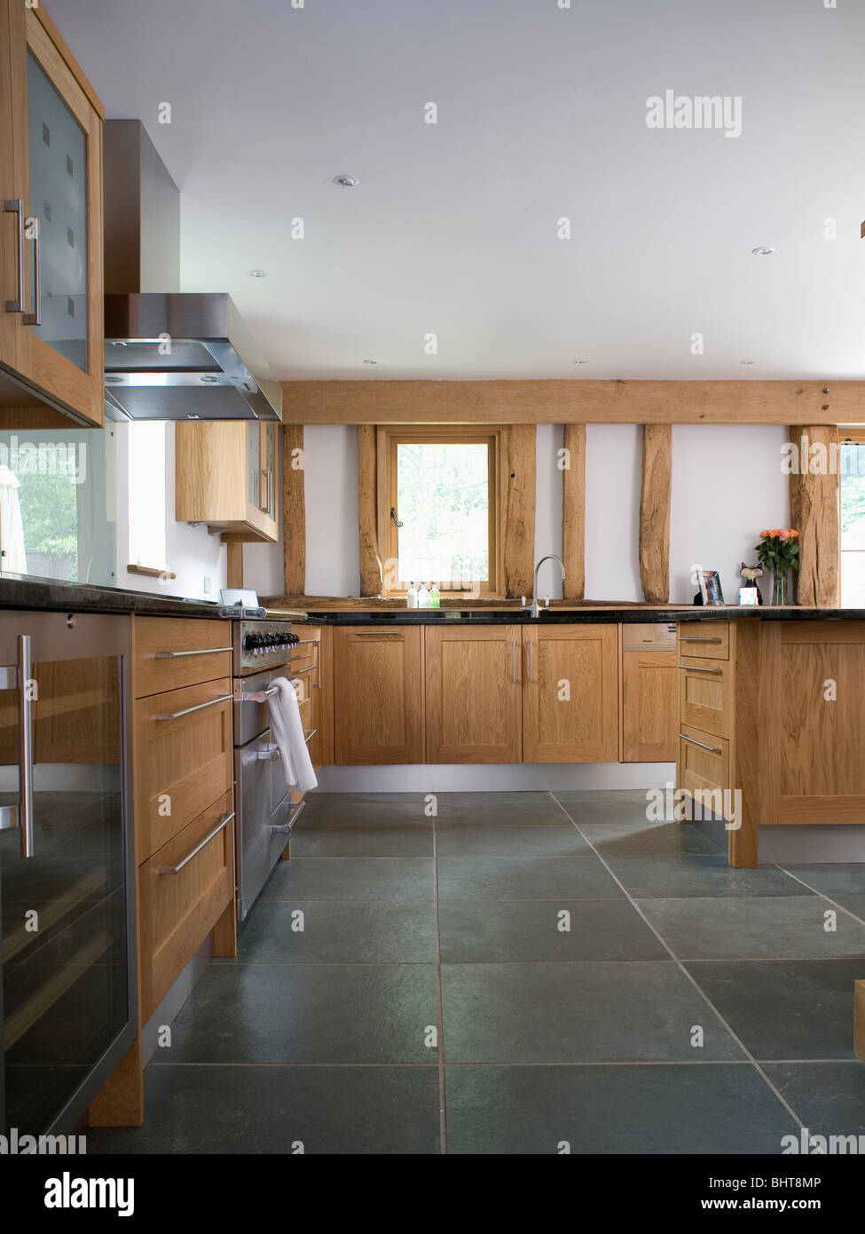 Slate Flooring In Large Modern Country Kitchen With Pale Wood