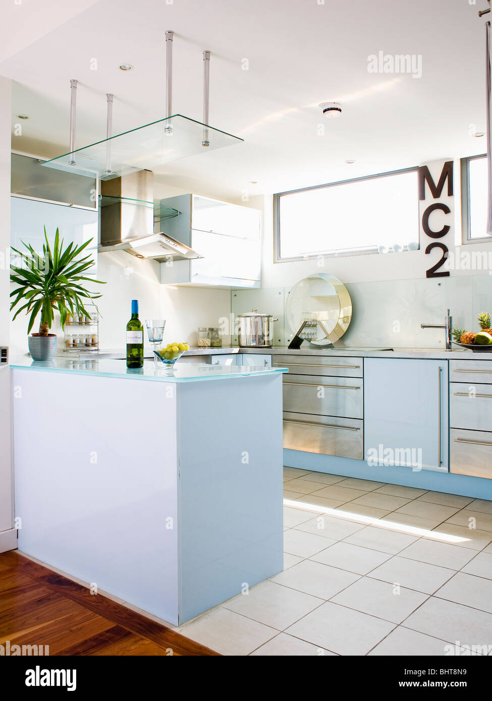 Cream Ceramic Floor Tiles In Modern White Kitchen With Peninsular Stock Photo Alamy