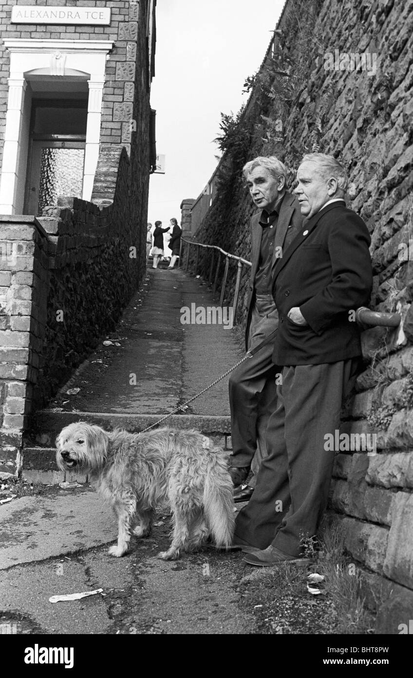 Elderly gentlemen reminisce about the good old days with a life-long buddy at Alexandra Terrace, in a south Wales valleys town. Stock Photo